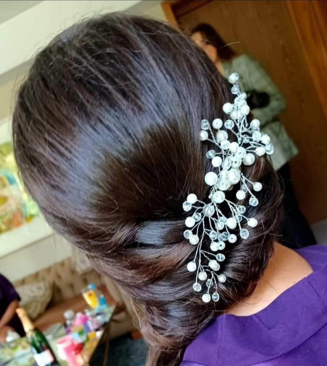 Elegant Pearl Updo - Sophisticated updo with cascading pearl accessories at Stella's Hair & Beauty Salon Barnsley